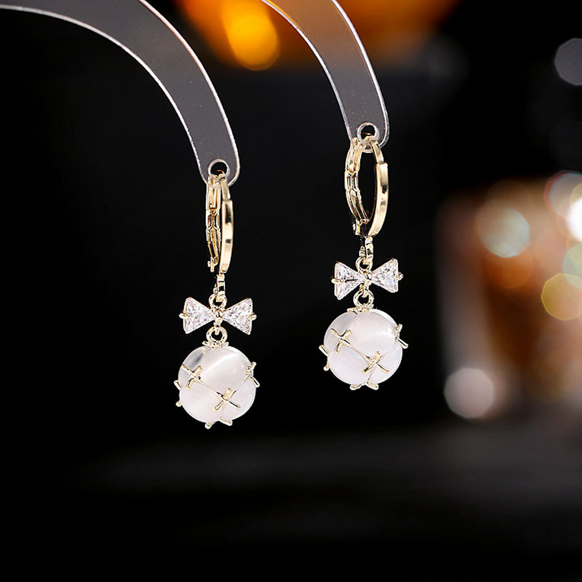 Bowknot Zircon Earrings (3D Ball Cat's Eye Stone)